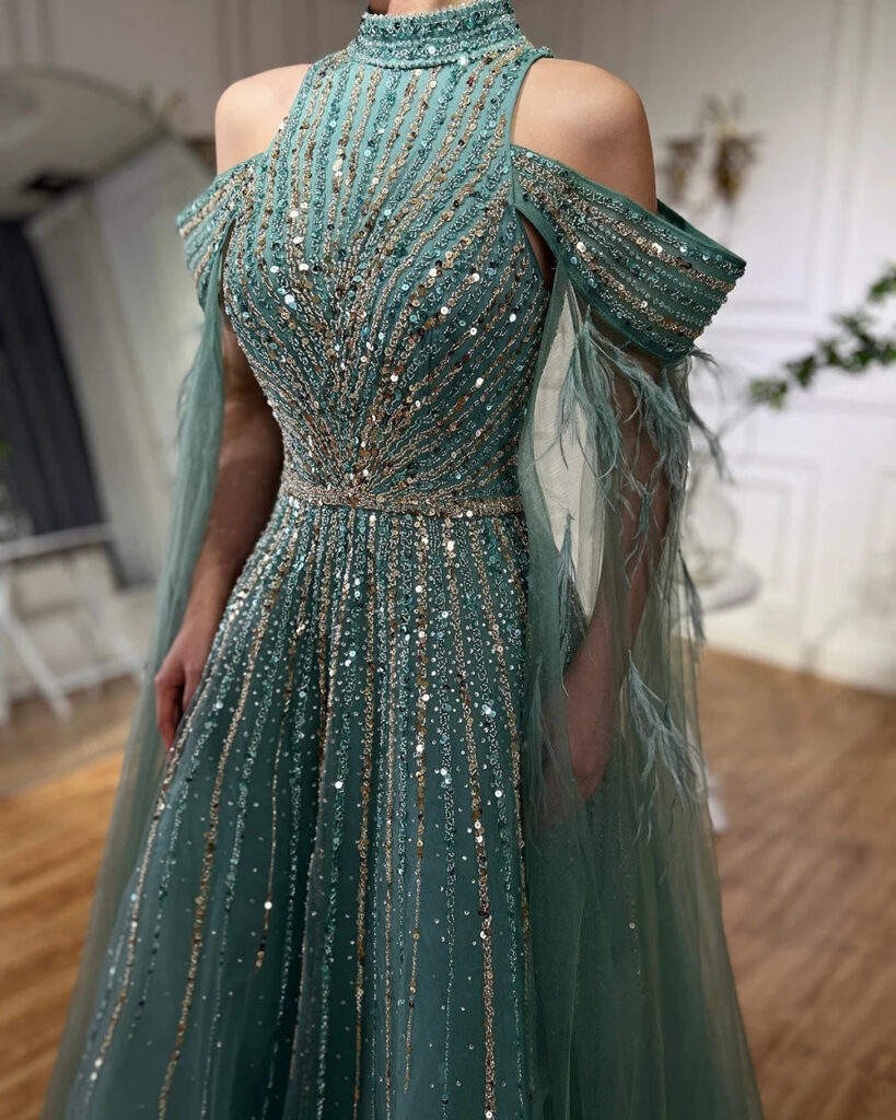 Nove Dress فستان سهرة تركواز قصة A-line مطرز ريش أكمام كيب عربي